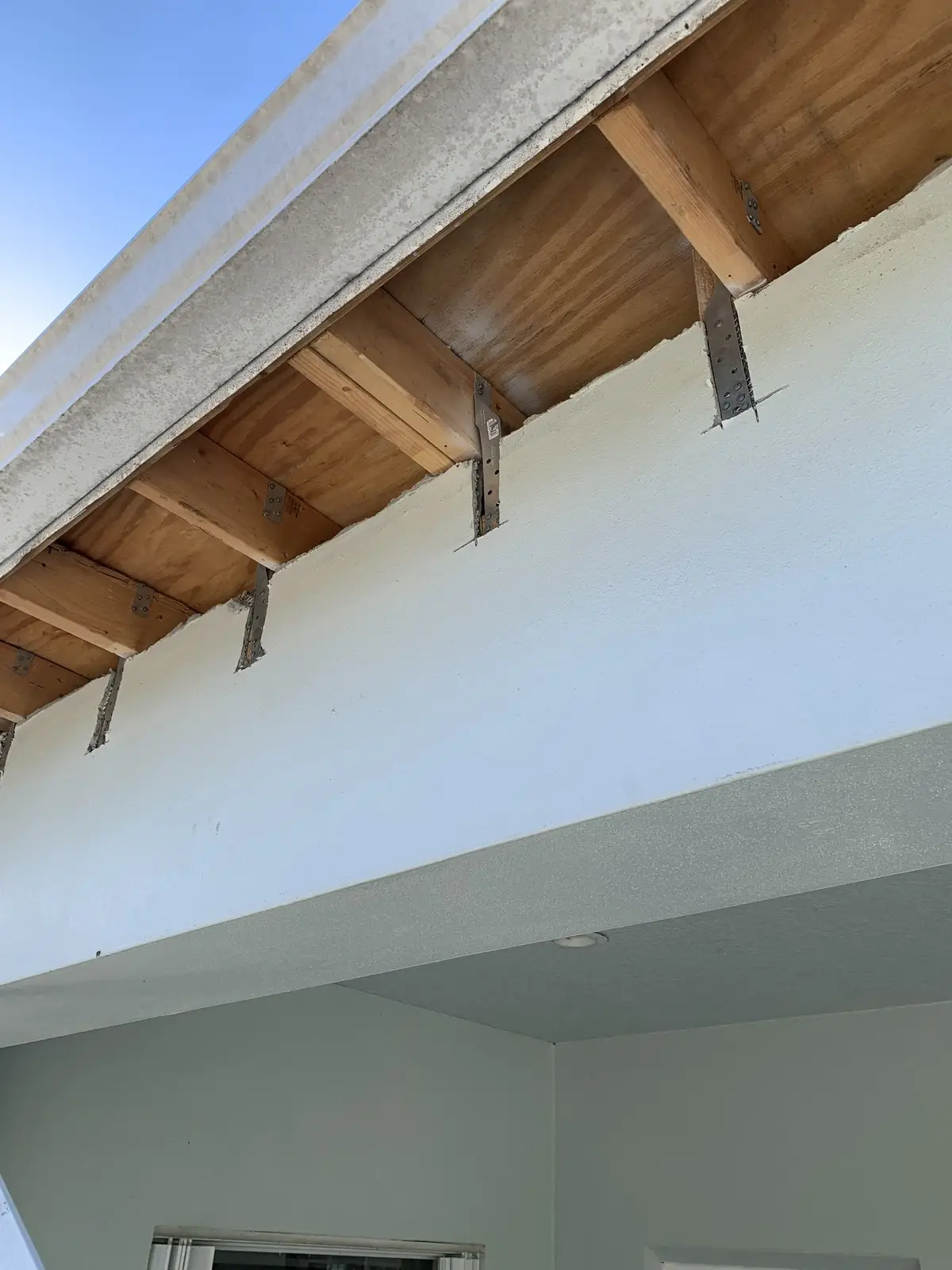Florida building code hurricane strap installation for insurance premium wind mitigation credit